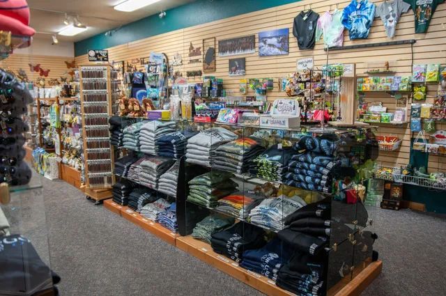 Store Filled with Lots of Shirts and Other Items