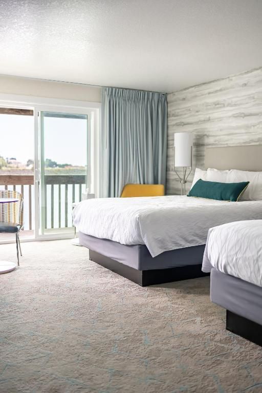 Hotel Room with Two Beds and A Sliding Glass Door