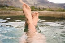 feet relaxed in mountai nlake