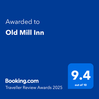 Award for Old Mill Inn, awarded by Booking.com with a 9.4 out of 10 rating for 2025.