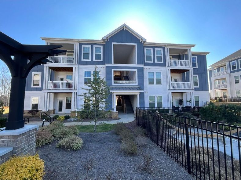 Apartment building with blue and white siding