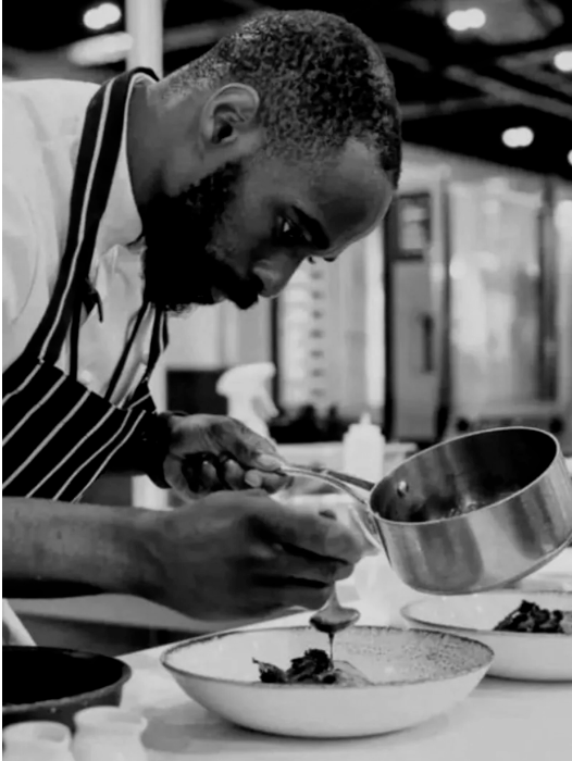 Chef David Henderson plating a dish, by REGO Creative