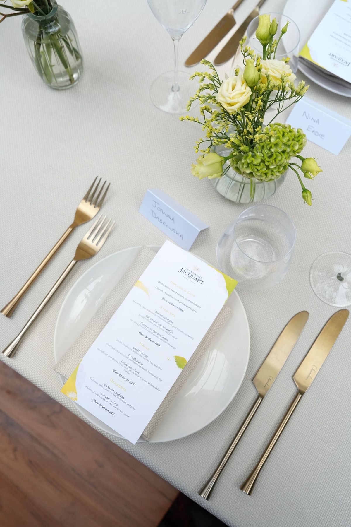 Champagne Jacquart branded menu and place setting at the launch dinner, by REGO Creative