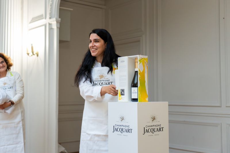 Odyssée Khorsandian unveiling the Champagne Jacquart limited edition bottle, by REGO Creative