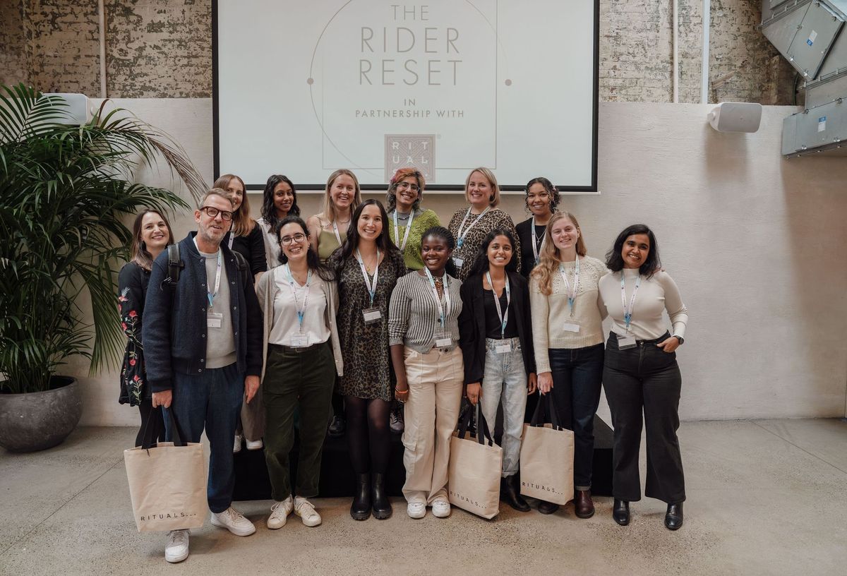 Guests and speakers posing together at The Rider Reset event in partnership with Rituals, Penguin Random House by REGO Creative