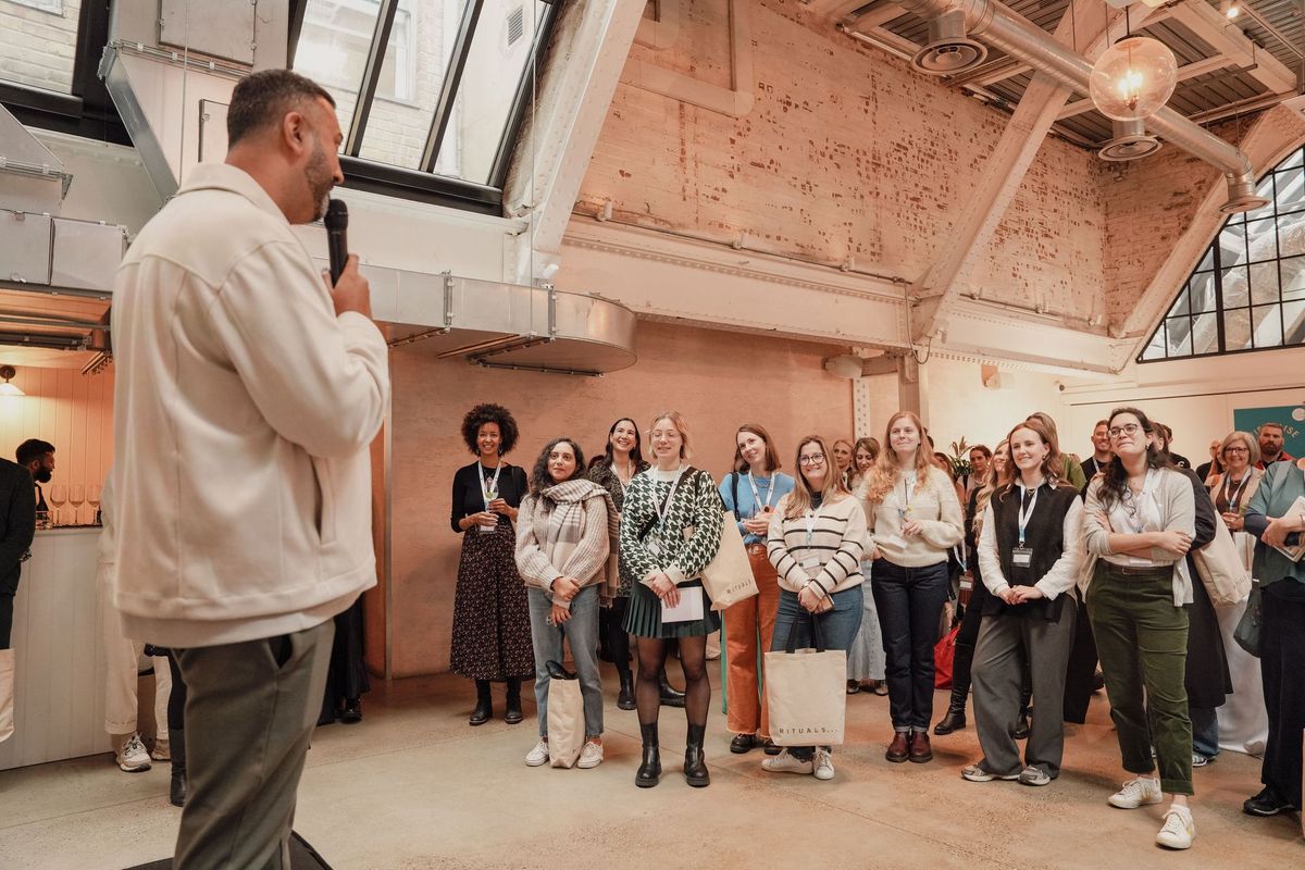 Host speaking to guests at The Rider Reset event in partnership with Rituals, Penguin Random House by REGO Creative