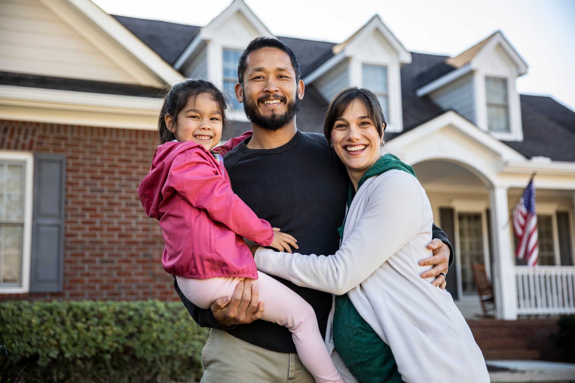 Family portrait in front of suburban home | Homeowners insurance company | McDonough, GA