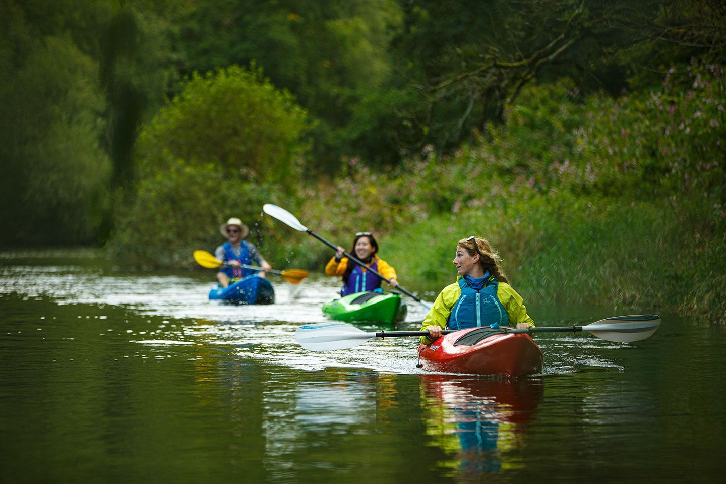 dagger axis kayaks paddling on a river