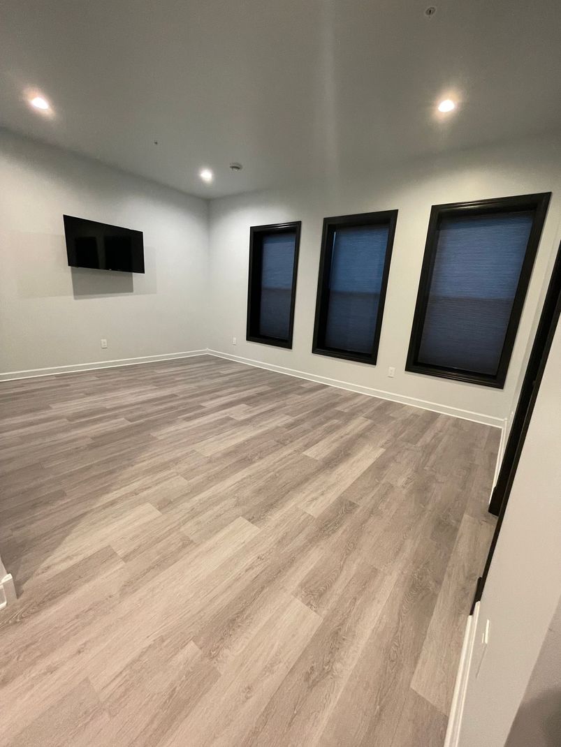 Person using laptop in modern apartment