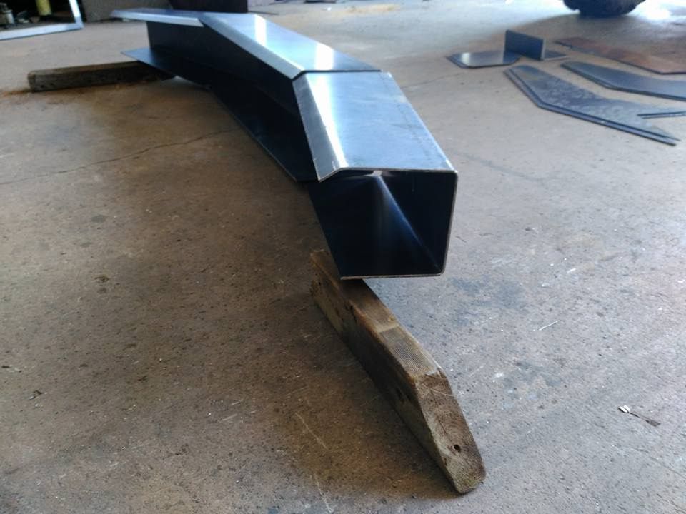 A Piece Of Metal Is Sitting On A Piece Of Wood — DJ Welding & Services in Currajong, QLD 