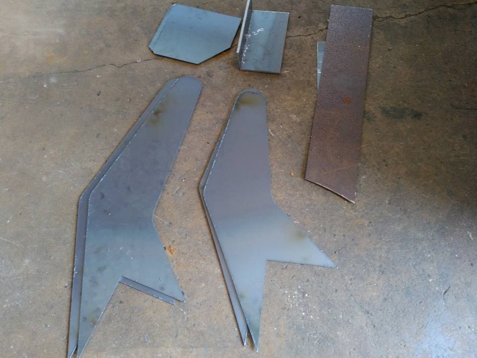 A Bunch Of Metal Pieces Are Laying On The Ground — DJ Welding & Services in Currajong, QLD 