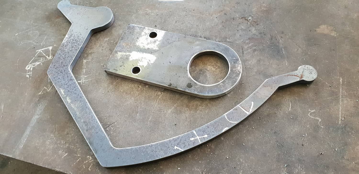 A Piece Of Metal Is Sitting On Top Of A Metal Surface — DJ Welding & Services in Currajong, QLD 