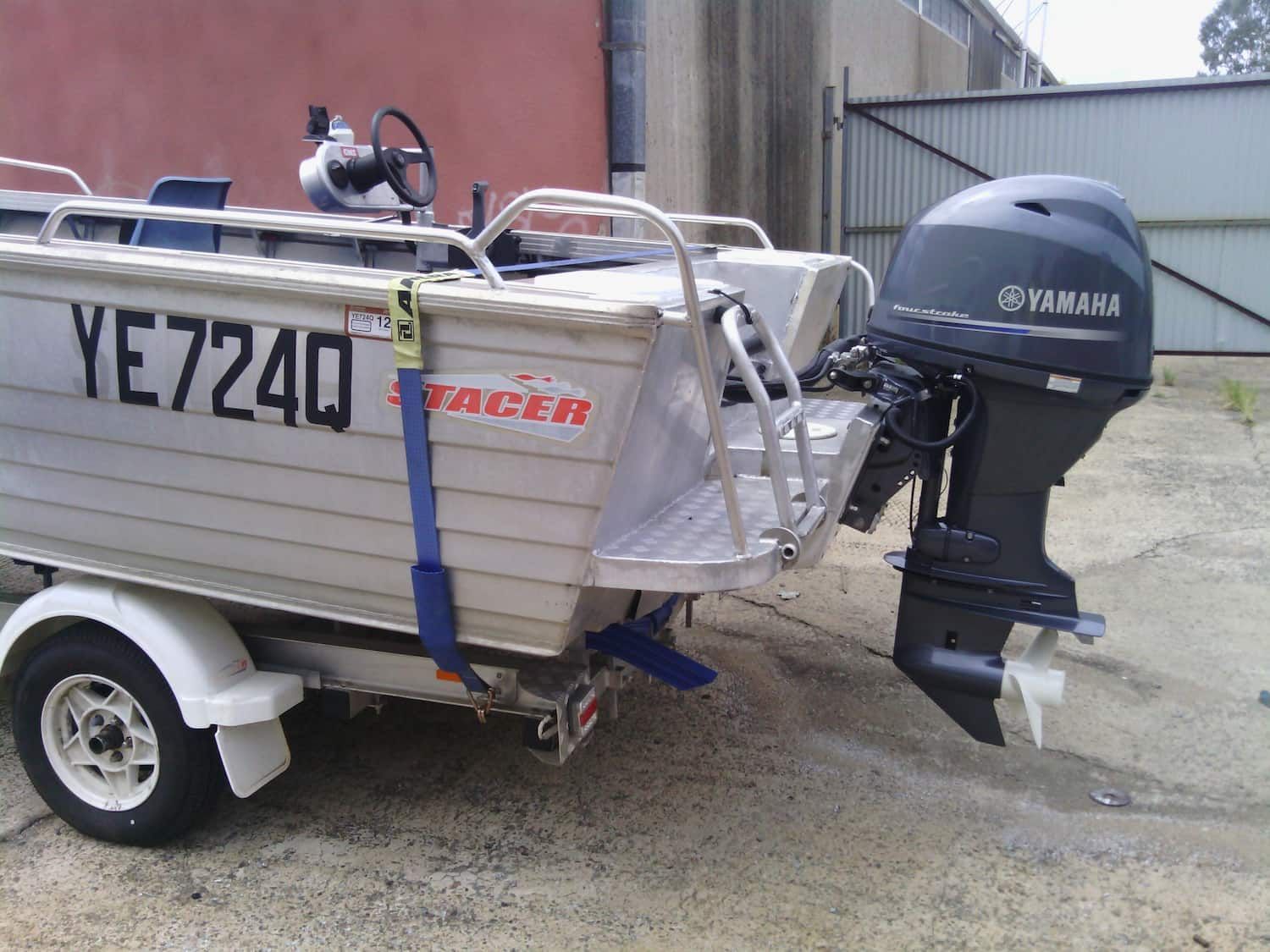 A Boat With A Yamaha Outboard Motor Attached To It — DJ Welding & Services in Currajong, QLD