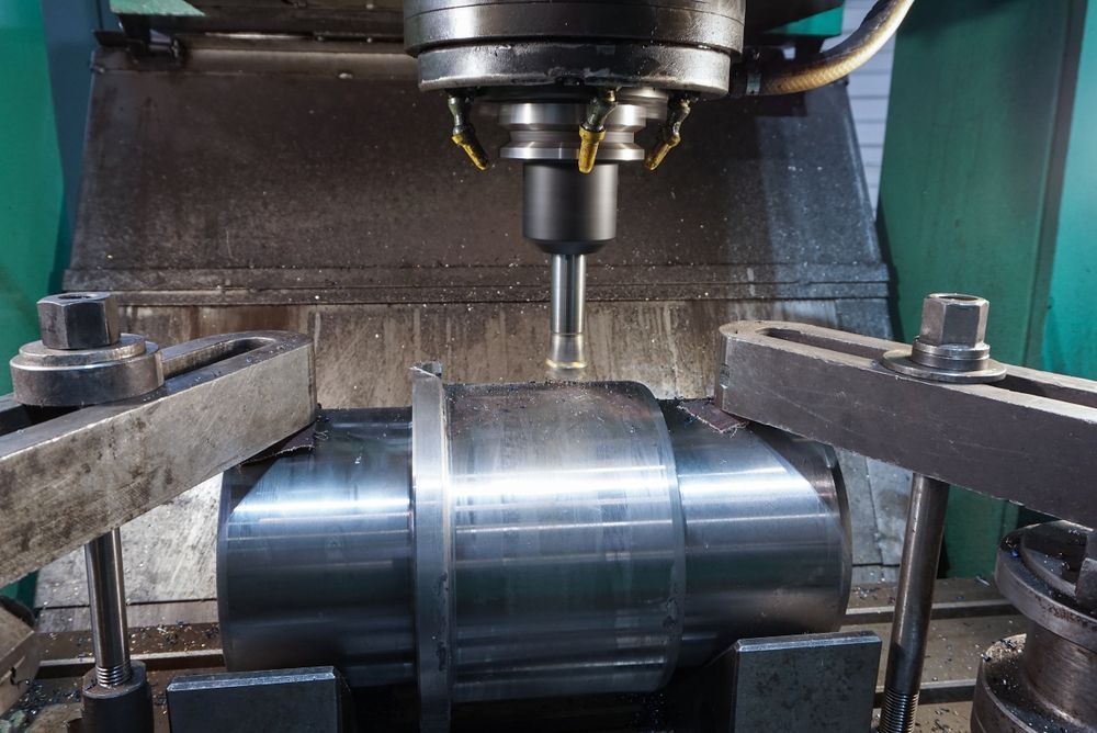 A Metal Ring With Holes In It Is On A White Surface — DJ Welding & Services in Currajong, QLD 