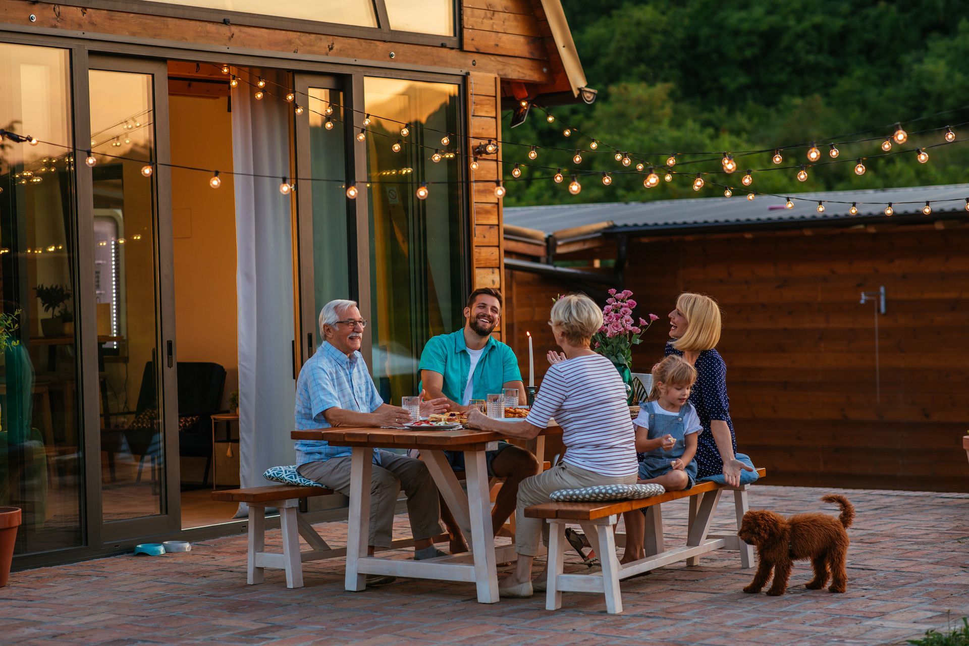 Family sitting down and eating dinner near Eagles Nest RV Park