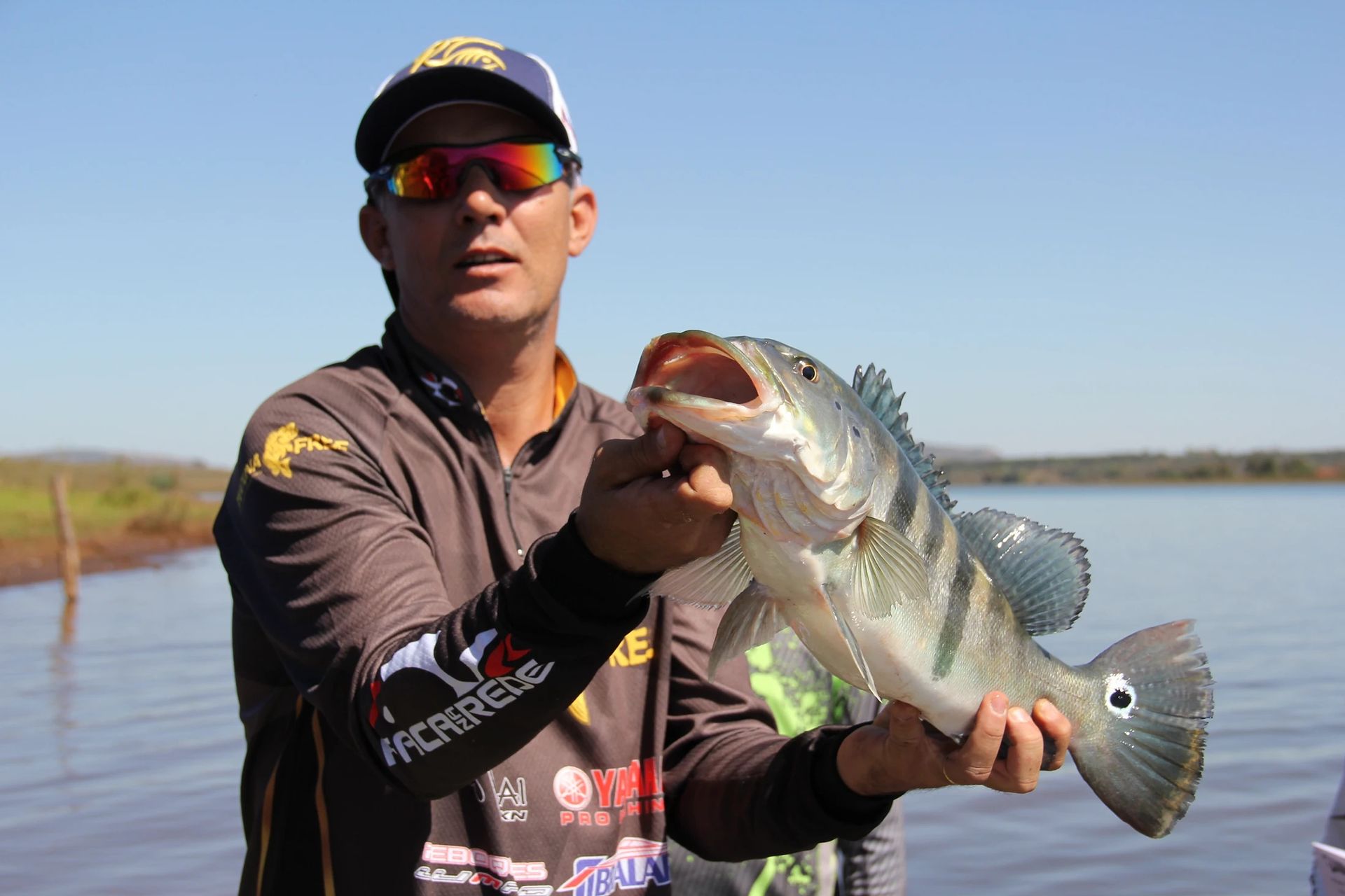 Fisherman holding bass on Lake Kentucky near Eagles Nest RV Park