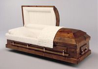a brown casket with the lid open