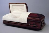 a dark wood casket with the lid open