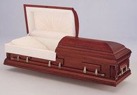 a wooden casket with the lid open on a white surface .