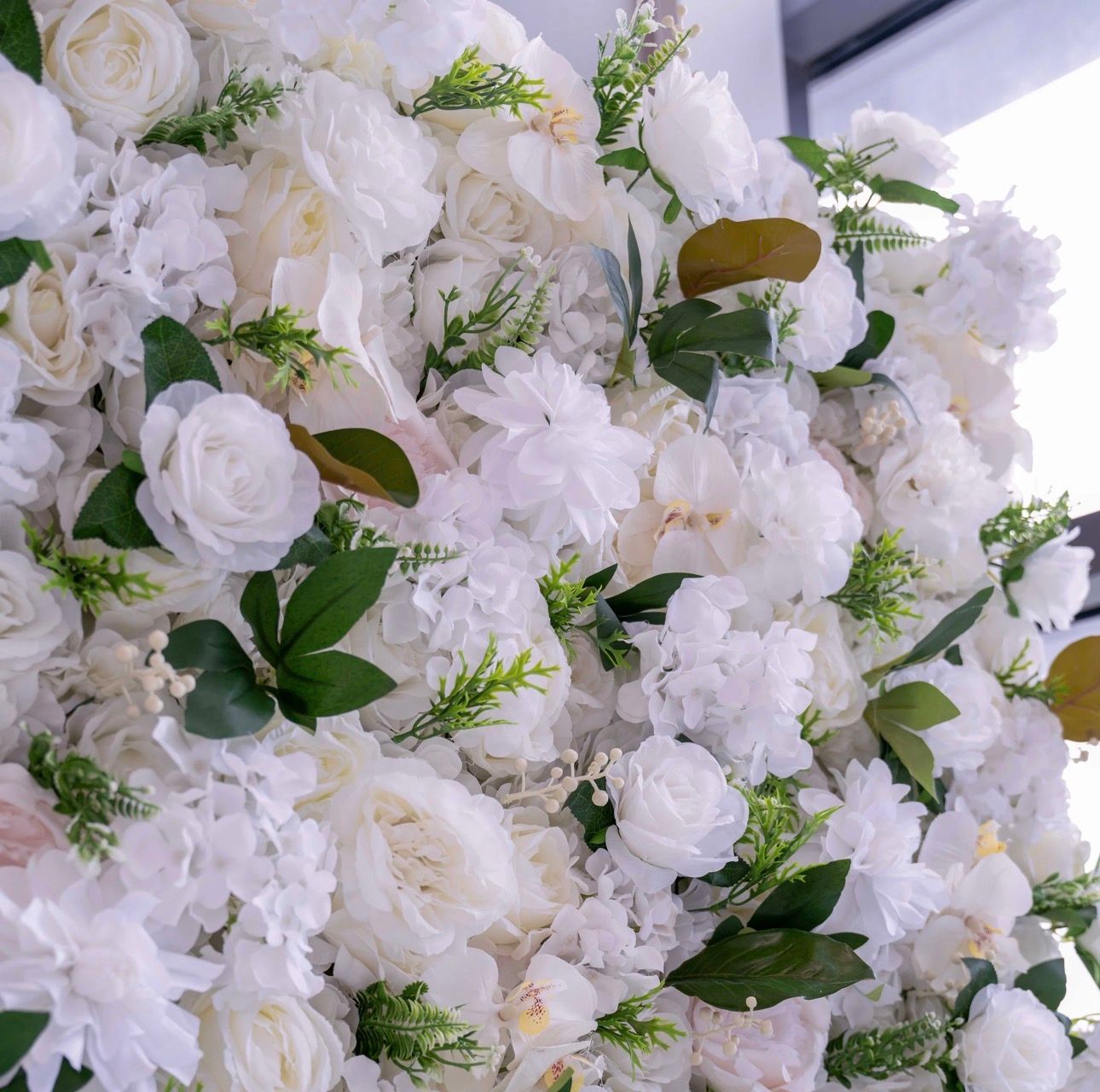 Flower wall photo backdrop at a Cork wedding