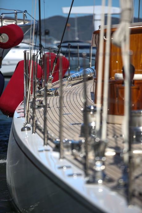 Wooden sailboat with red fenders in a harbor. | Gainesville Marine Repair