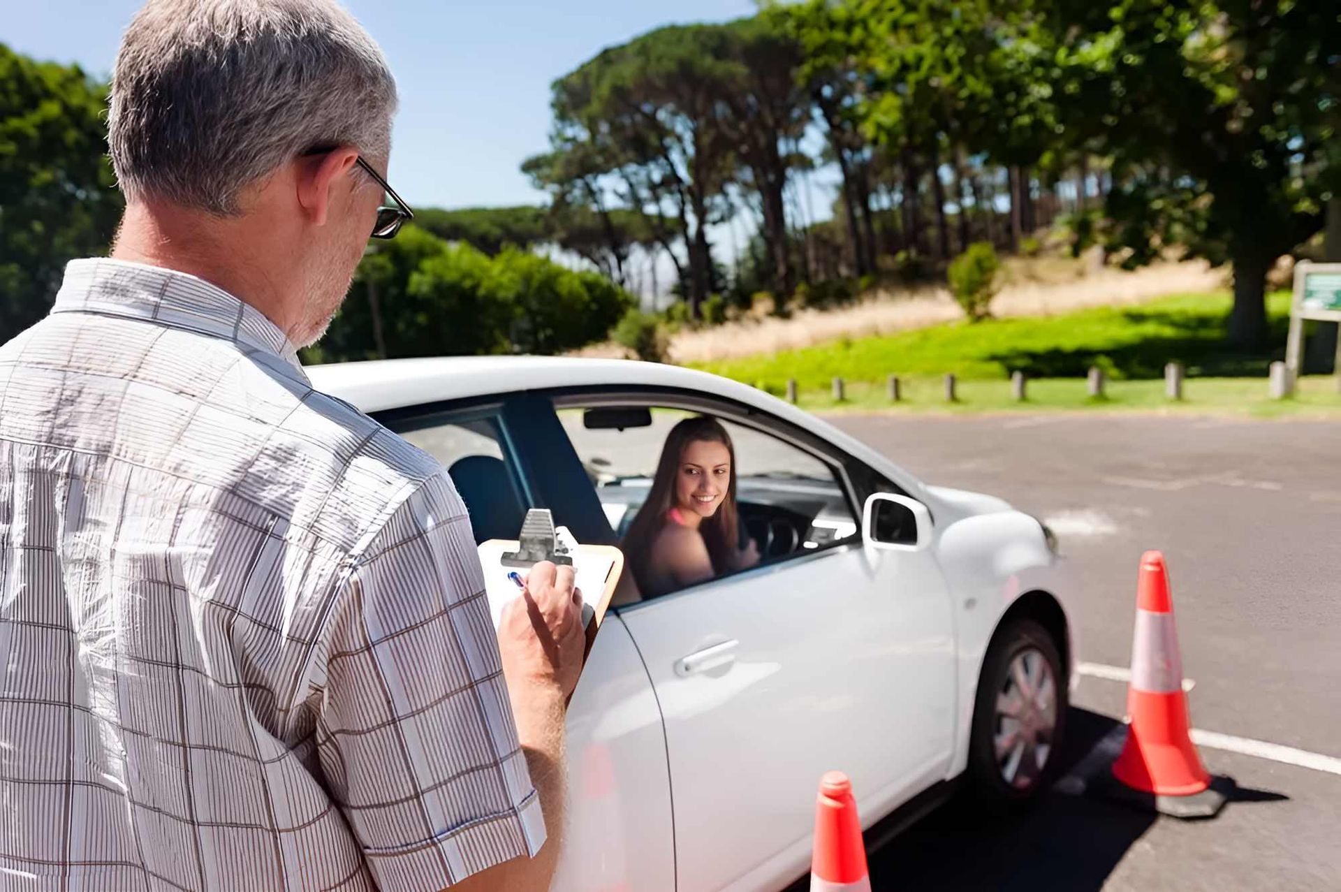 A Man is Taking a Picture of a Woman in a Car — Casino Driving School In Casino, NSW
