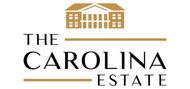Logo for The Carolina Estate featuring a gold-colored building icon and text.
