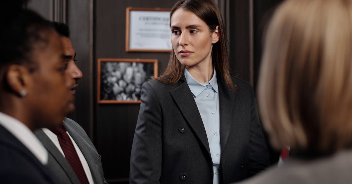 Lady dressed in a suit sitting in an office