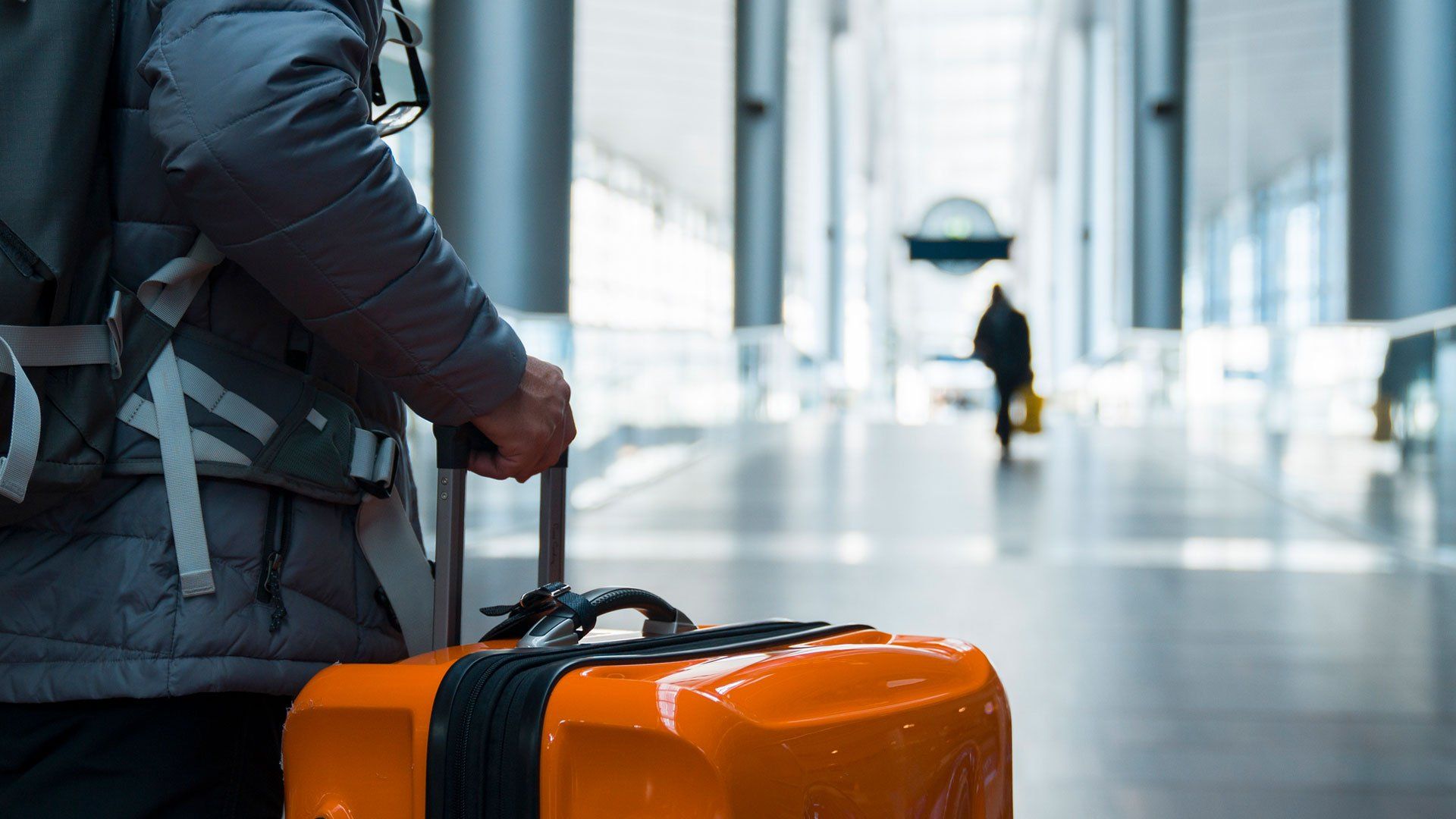 Man Walking with Suitcase at Airport Terminal — Forest Lake QLD — yourvisa4australia
