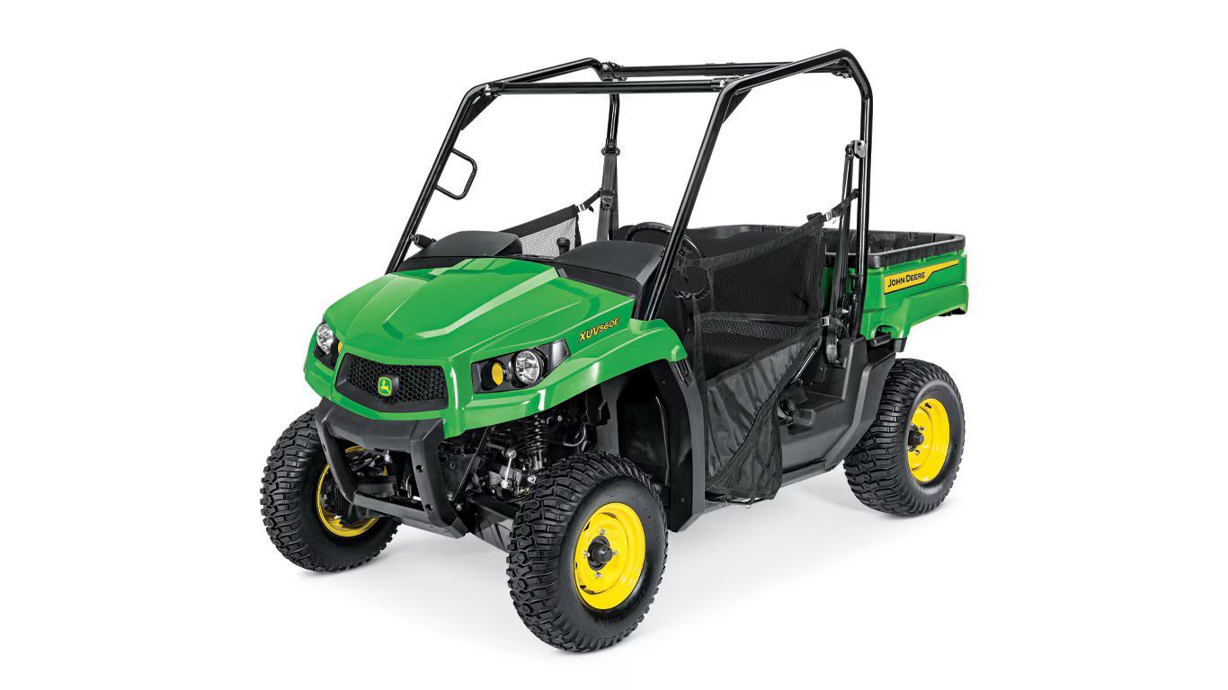 Green John Deere Gator UTV with black roll cage, yellow wheels, and cargo bed.