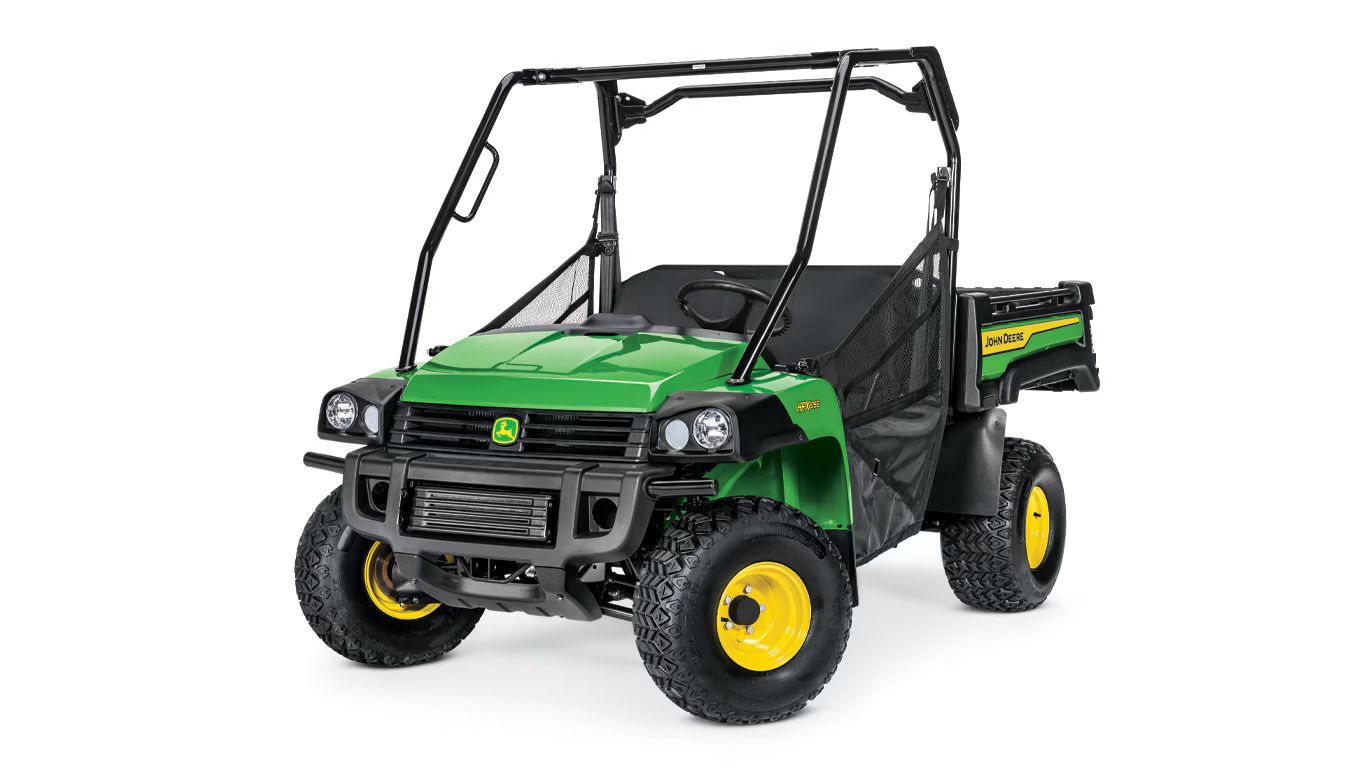 John Deere Gator utility vehicle in green and black, with yellow wheels, on a white background.
