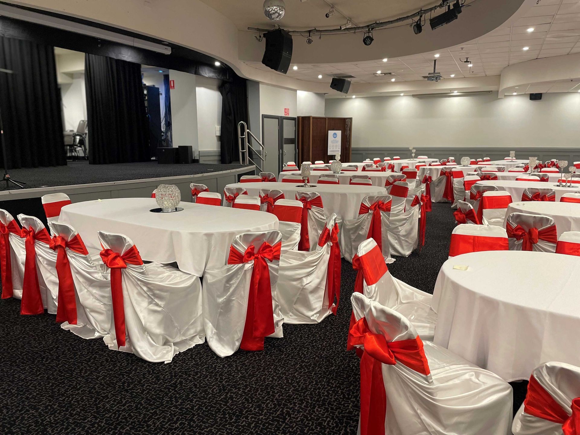 Red Tie Back Chairs — Sydney, NSW — Affordable Chair Covers & Candelabras
