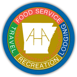AAA membership emblem with blue, red, green, and gold circular seal and white center logo