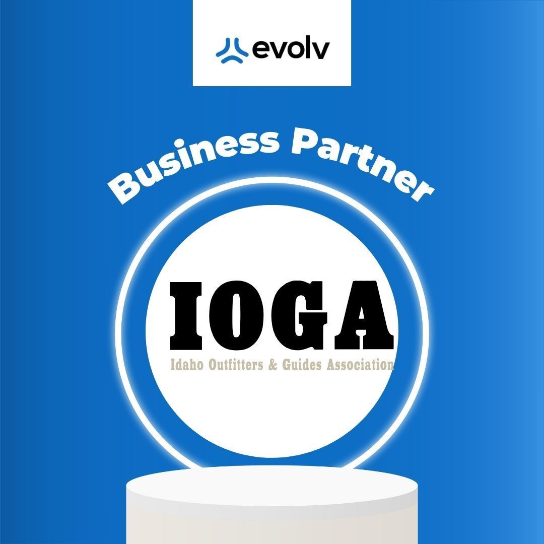 Blue business partner badge with Evolv logo and a circular IOGA logo on a pedestal.