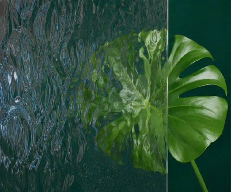 Green tropical leaf behind textured, translucent panels on a dark green background