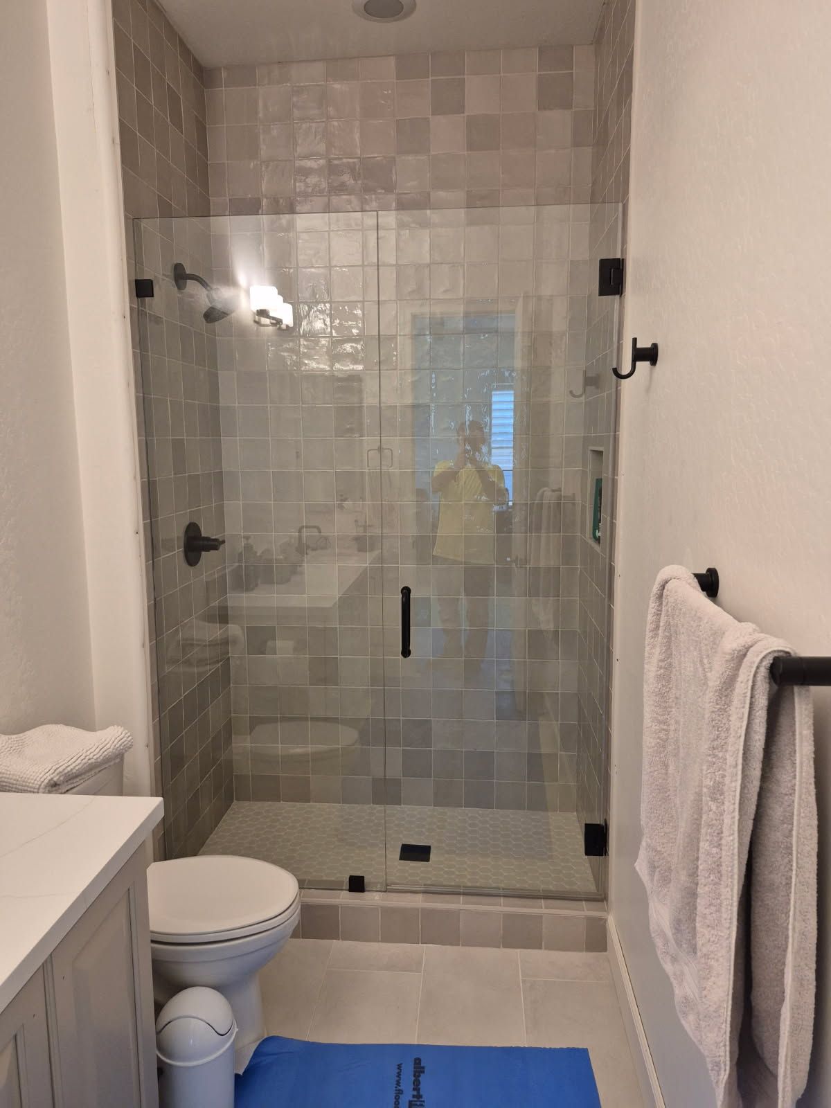Luxury custom frameless glass shower enclosure in a modern Scottsdale bathroom.