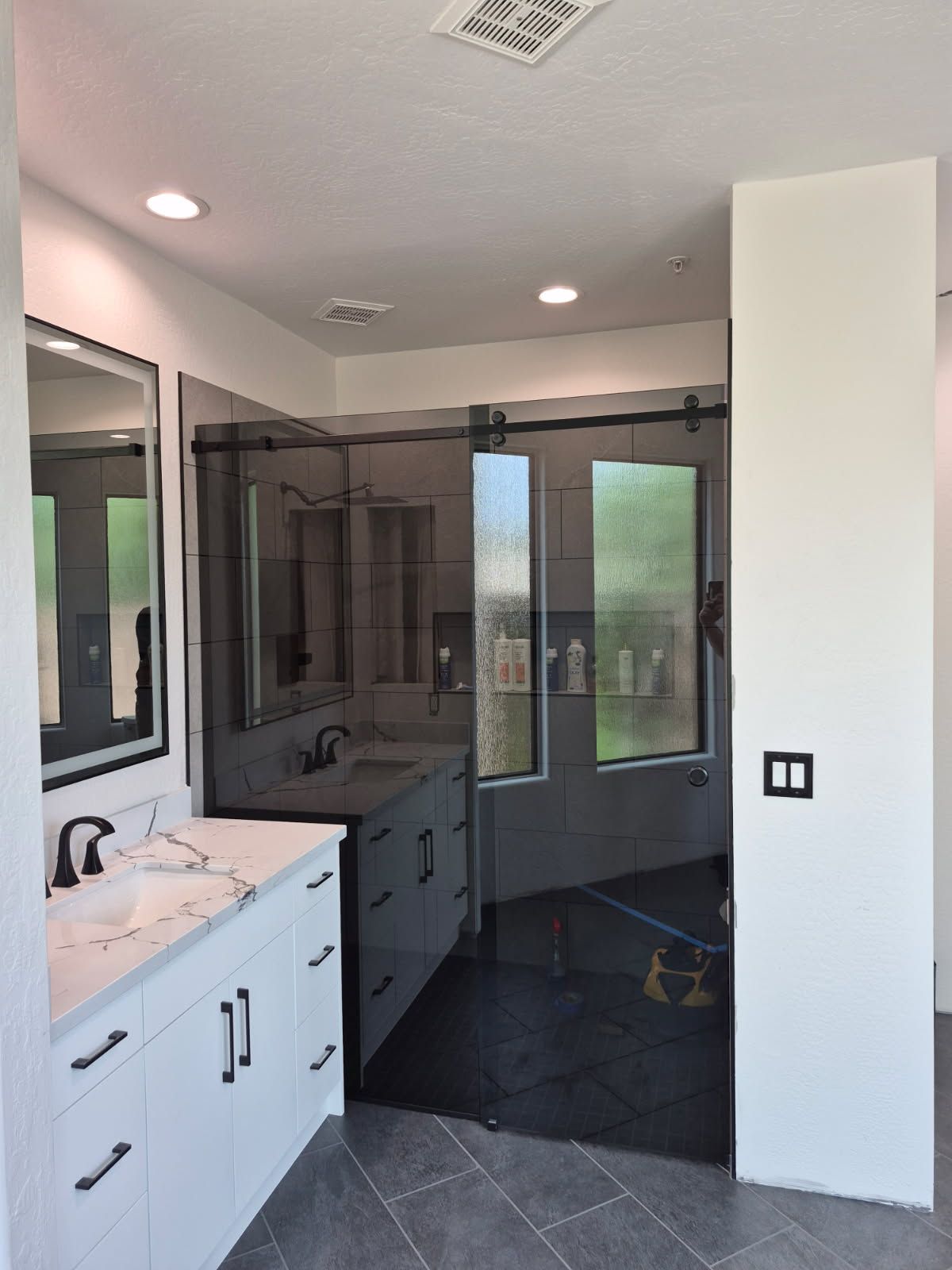 Multiple sliding frameless shower door installation by ABC Glass Company in Phoenix, Arizona.