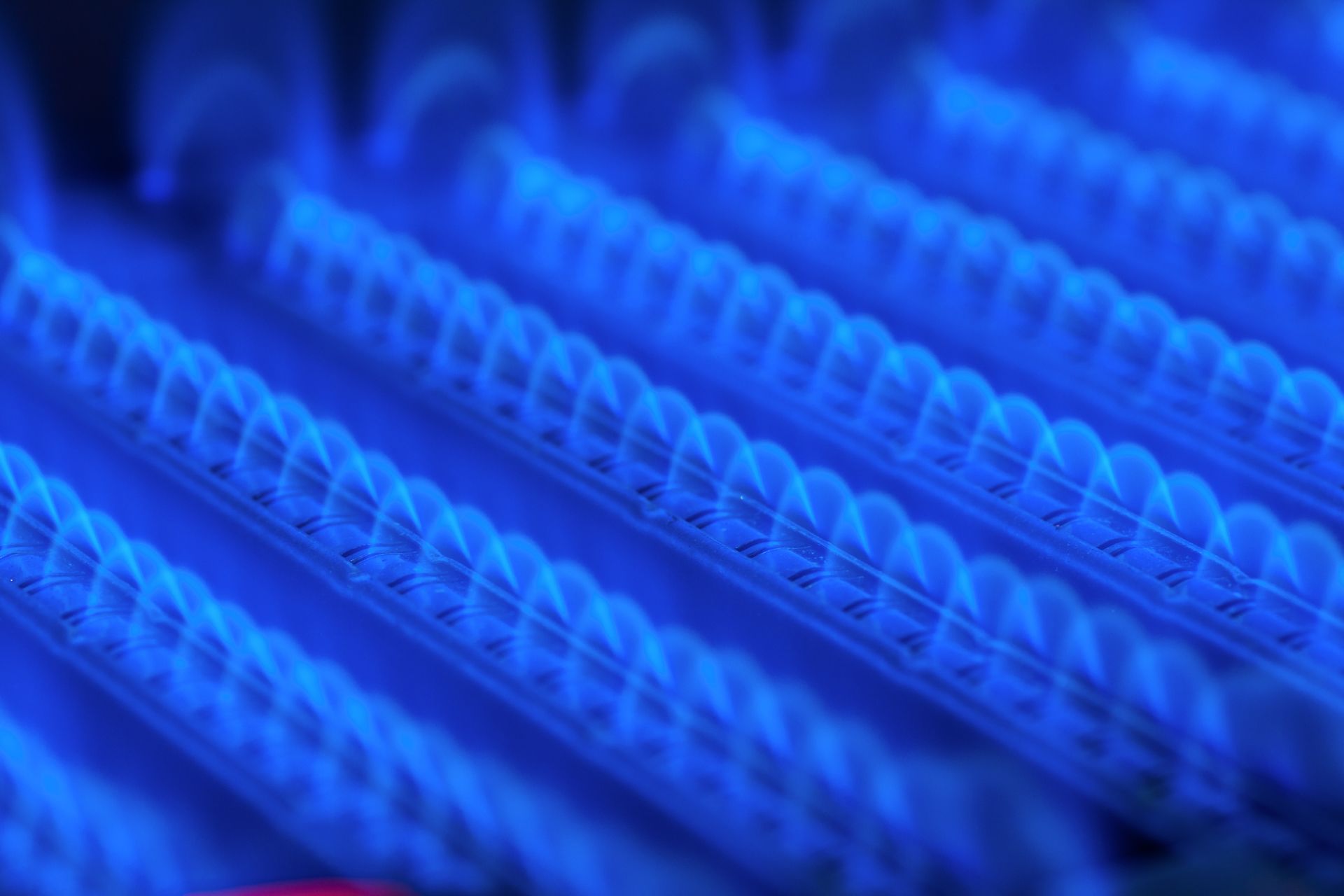 Close-up of glowing blue LED light strips in diagonal rows