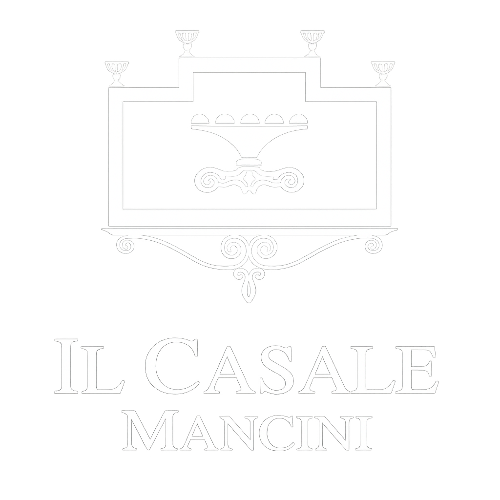 Logo minimalista bianco per Il Casale Maccini con un edificio stilizzato e un carro trainato da cavalli.