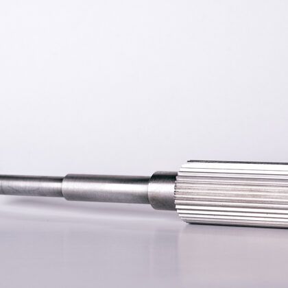 Metal shaft with grooves on one end, various cylindrical sections.