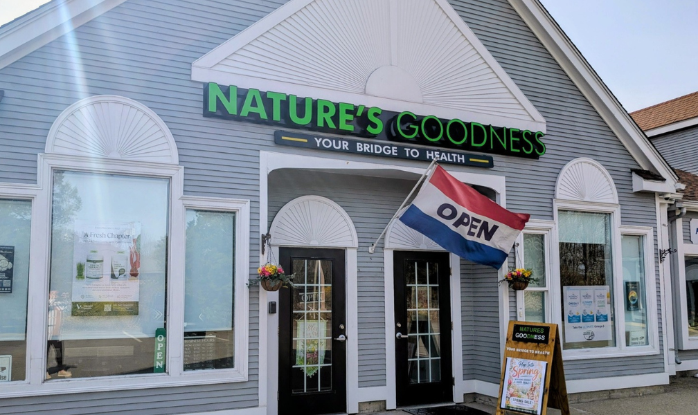 Storefront of Nature's Goodness with an open sign and black-and-white exterior