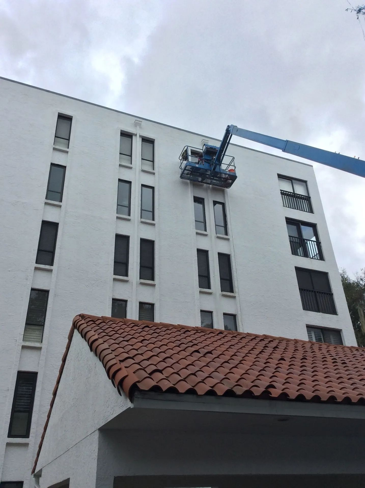 men fixing building window