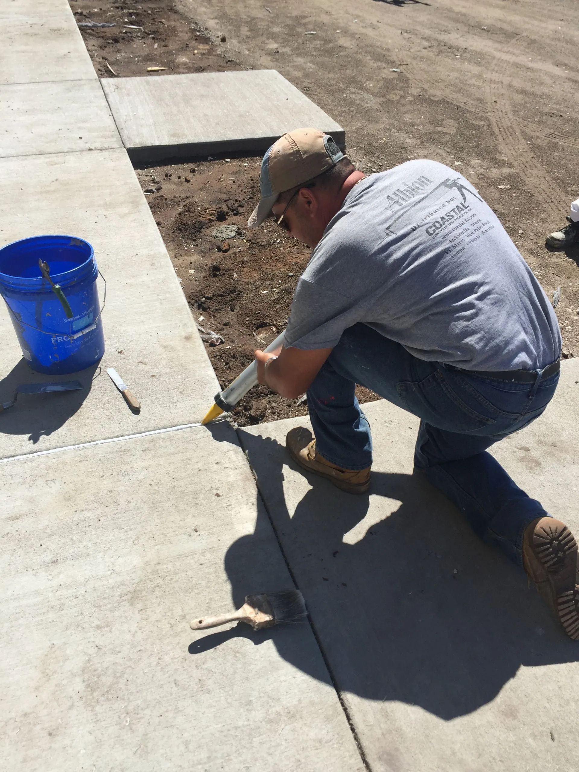 man fixing a concrete pavement