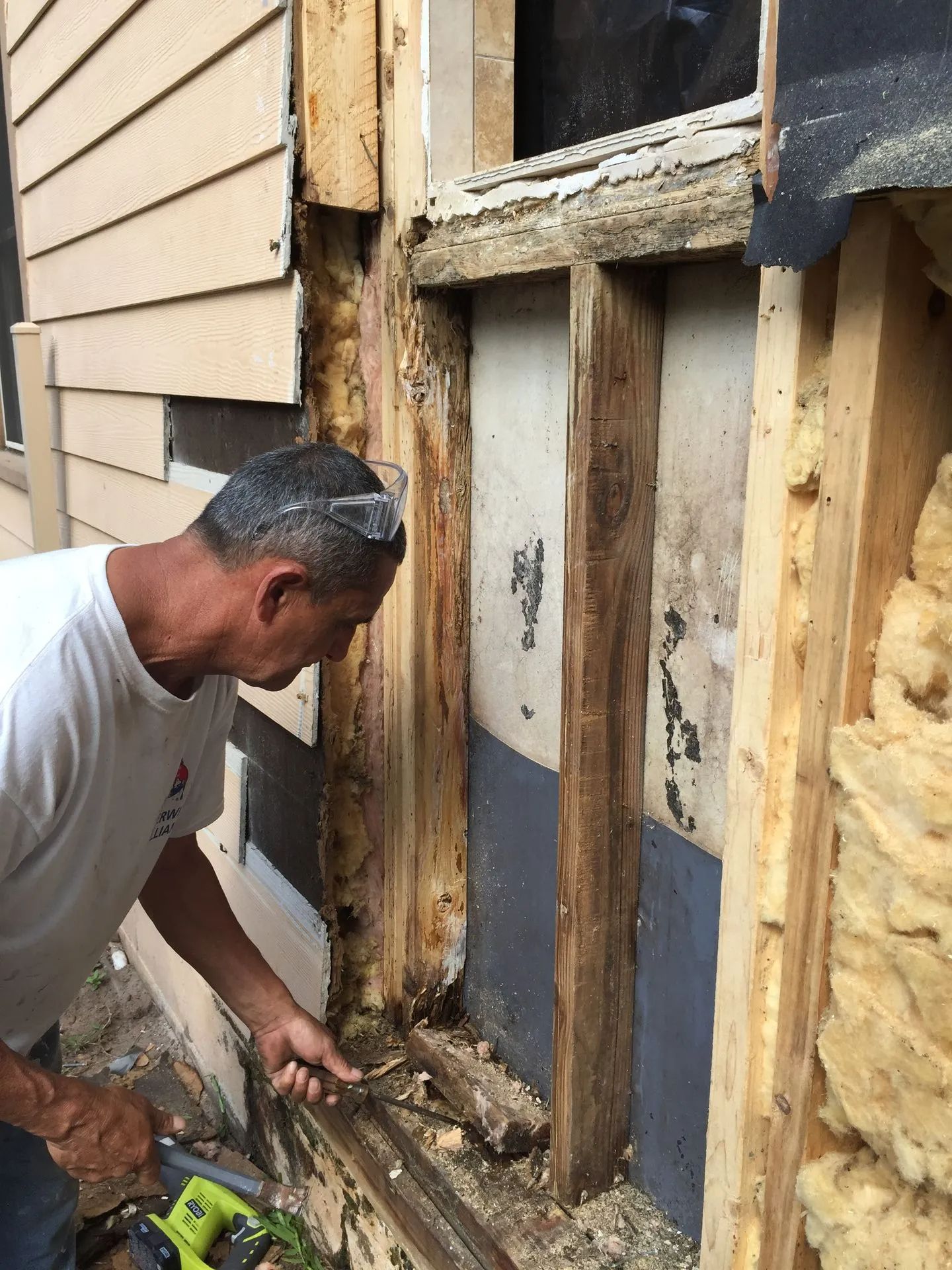 man fixing a window