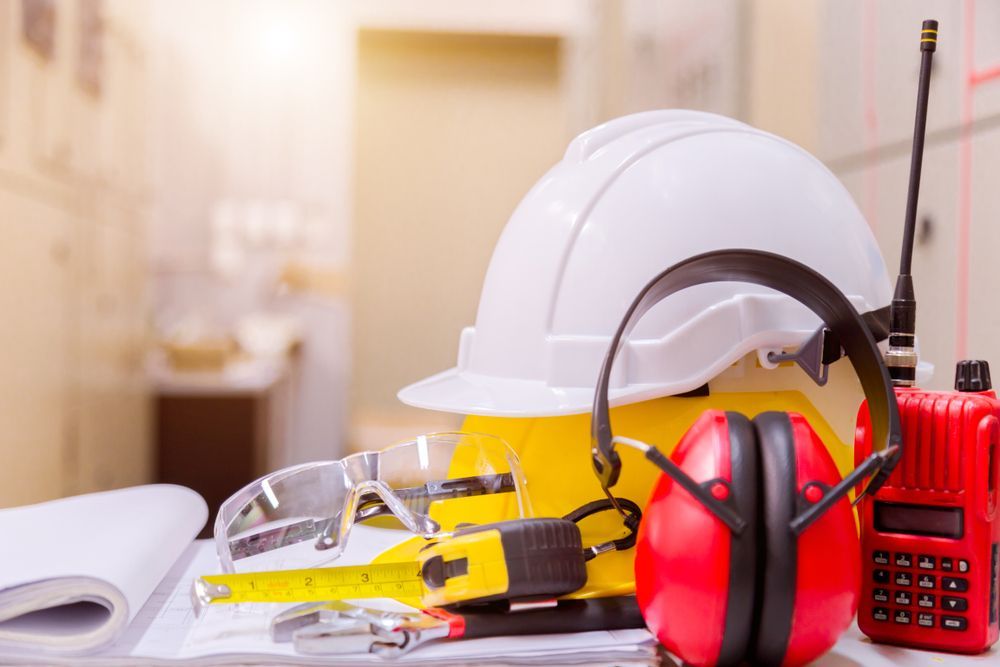 Safety Equipment White and Yellow Hard Hats, Ear Muffs, Safety Glasses — Industry Fire Services in Atherton Tablelands, QLD