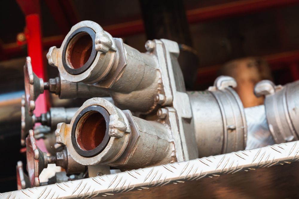 Silver Fire Hose Connections on a Fire Truck — Industry Fire Services in Port Douglas, QLD