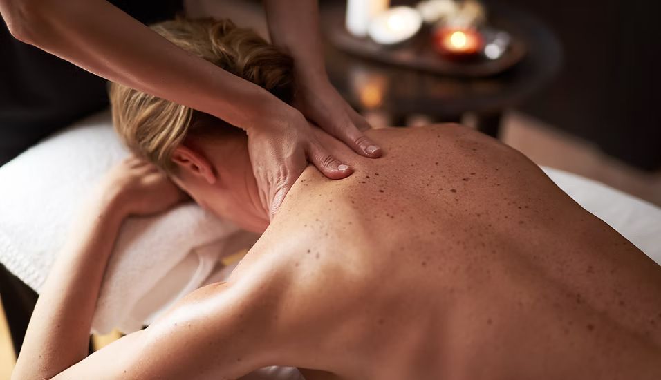 A woman is getting a massage at a spa.