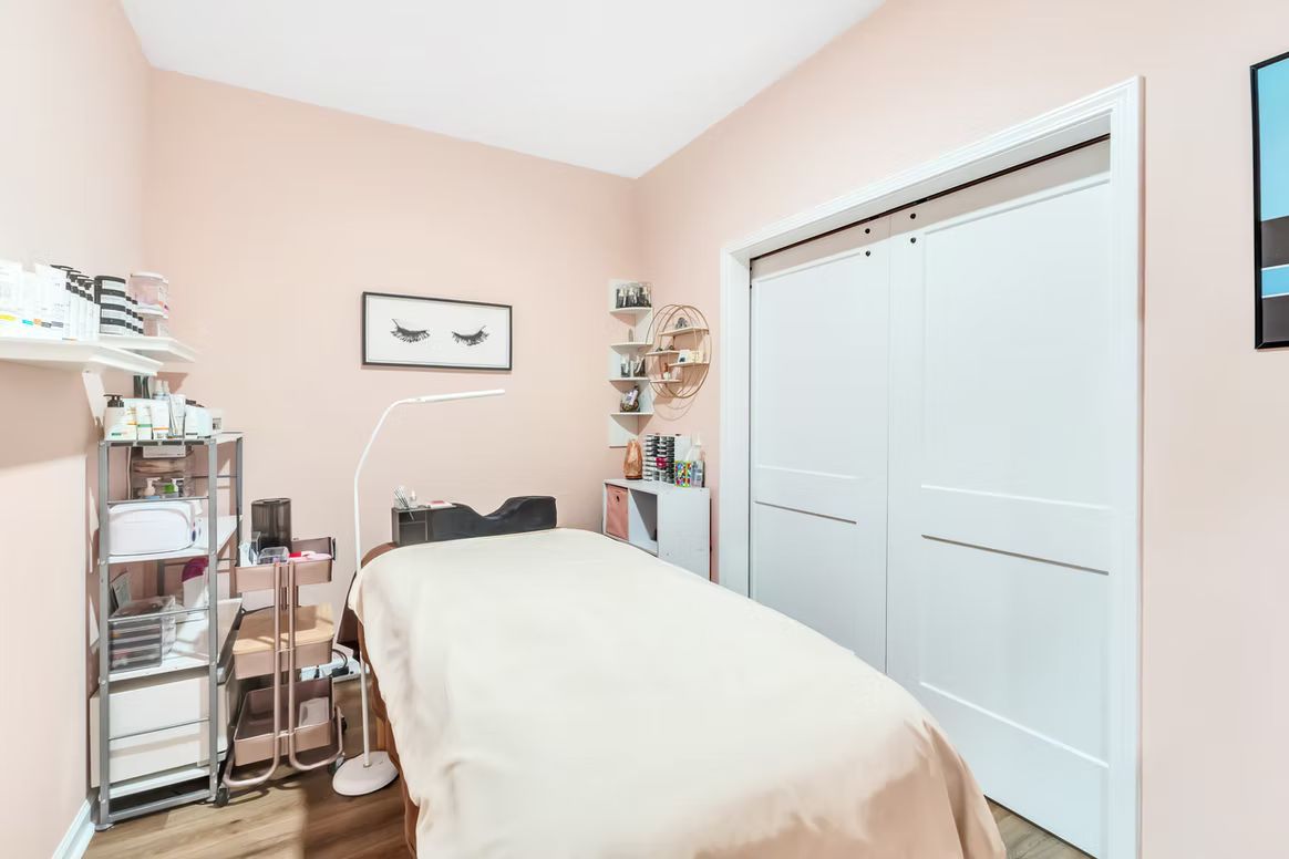There is a massage table in the middle of the room.