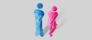 Ein Mann und eine Frau stehen nebeneinander vor einem grauen Hintergrund.