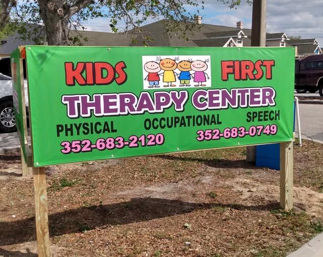 A green sign for kids first therapy center